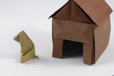 Puppy in Front of a Doghouse