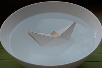 Traditional paper boat folded from cheese tray paper