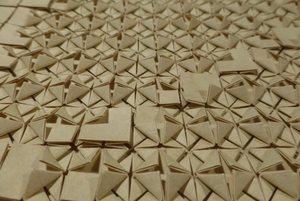 Some corners folded up in order to create a pixel image